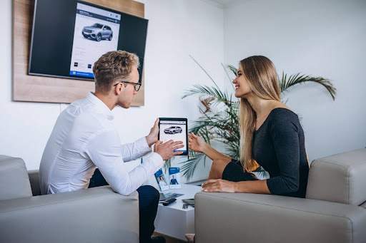 Customer comparing compact rental car options with agent