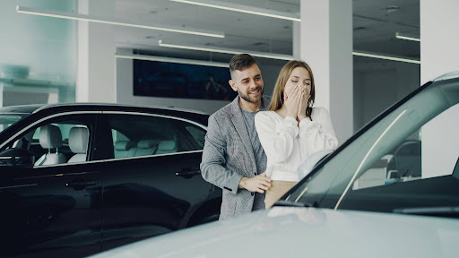 Family choosing an affordable rental vehicle for summer travel