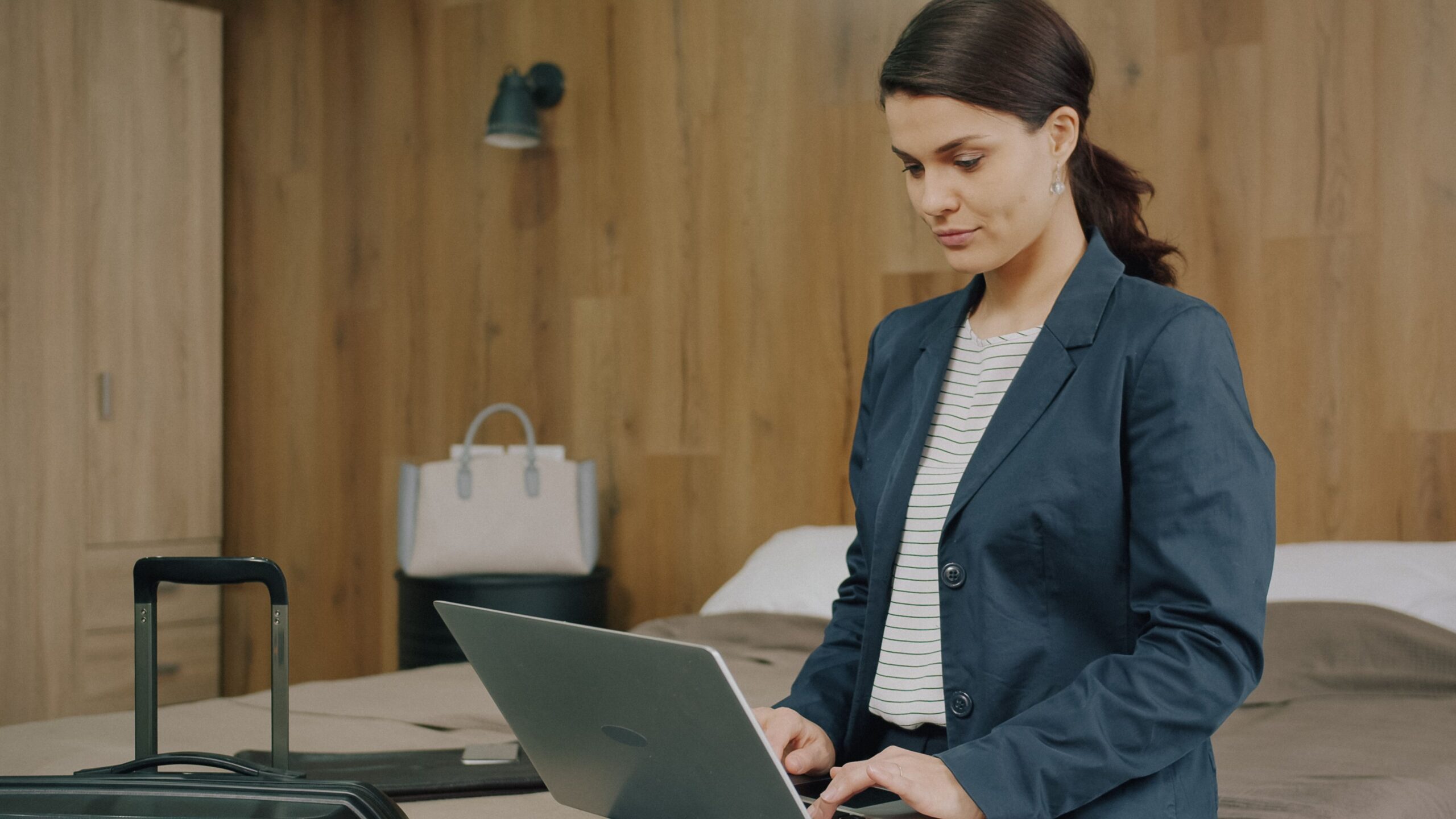 Renter reviewing an insurance policy on a laptop before a trip